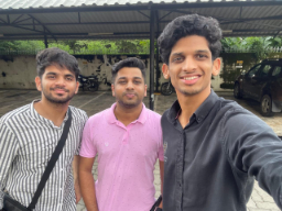 Group selfie outside building